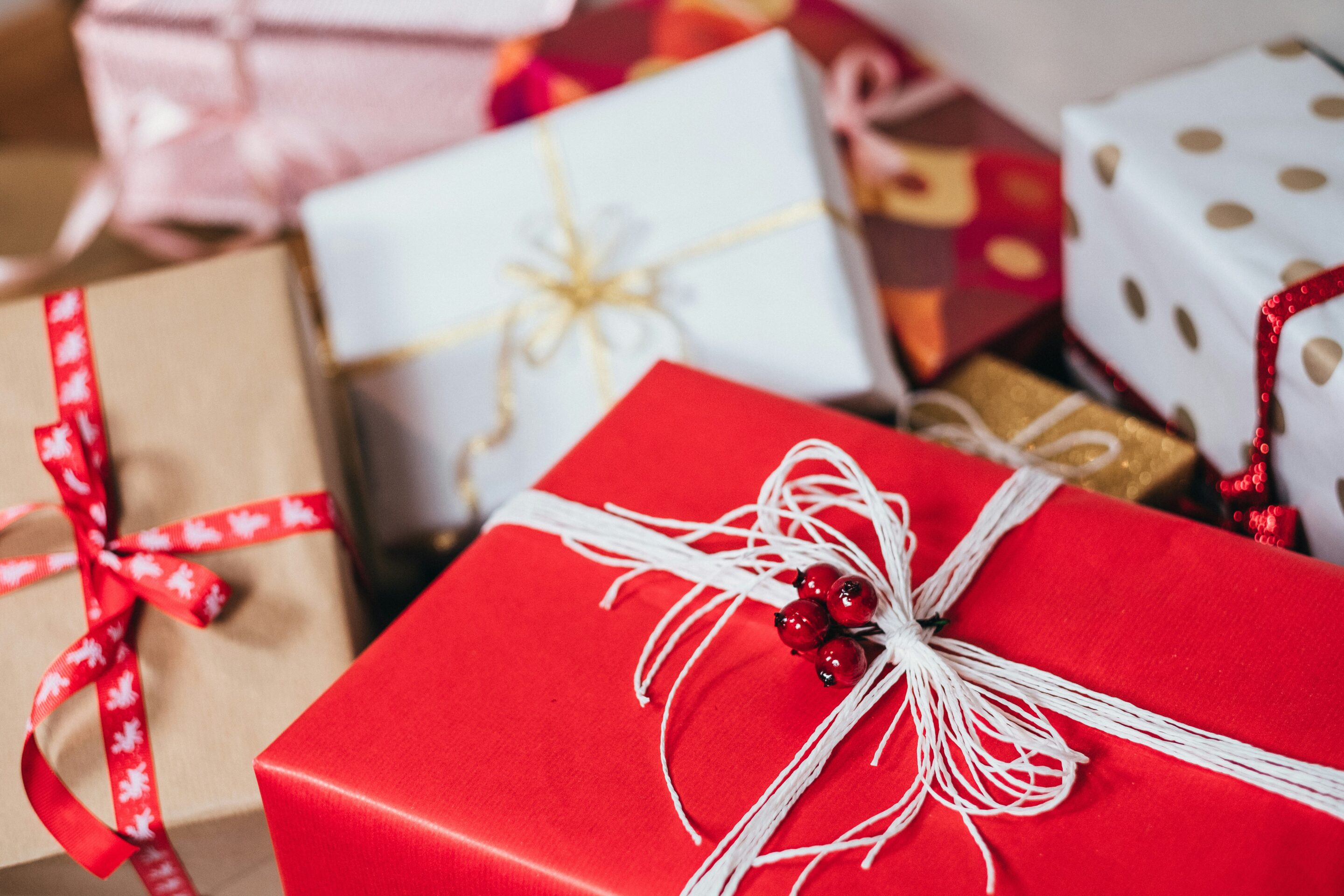 Digital Holiday Shopping packages wrapped in red and white and gold